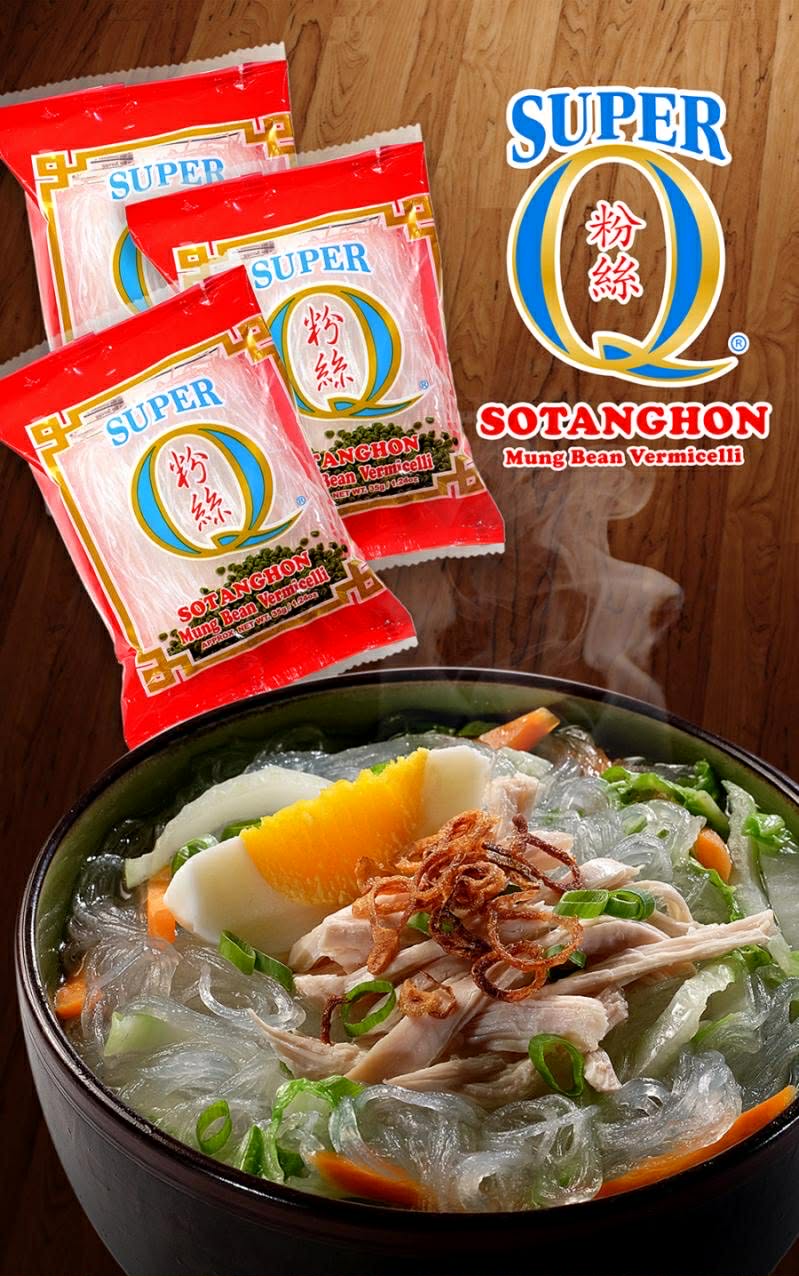 Three packs of Super Q Sotanghon mung bean vermicelli beside a bowl of chicken sotanghon soup with shredded chicken, carrots and fried shallots
