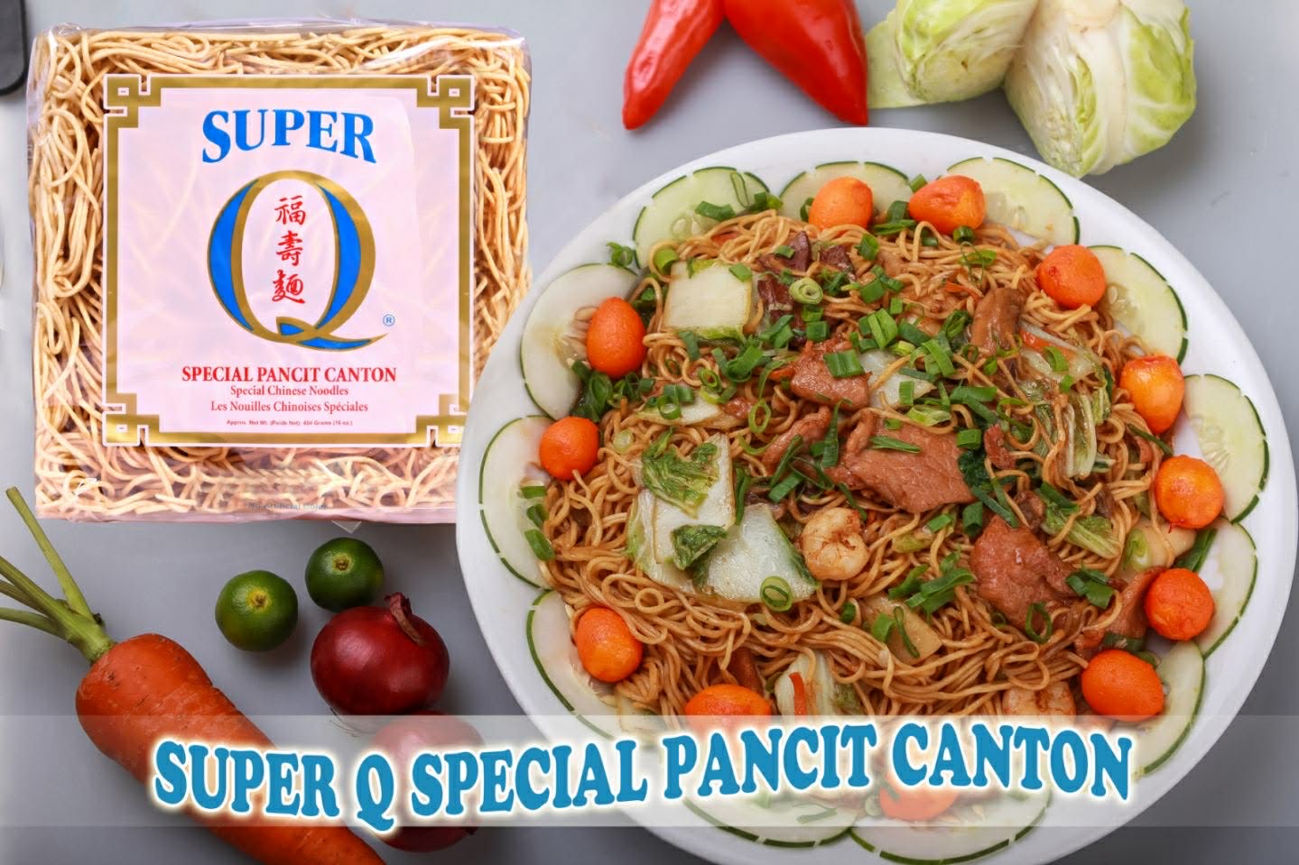 A pack of Super Q Special Pancit Canton beside a plate of cooked pancit canton topped with vegetables